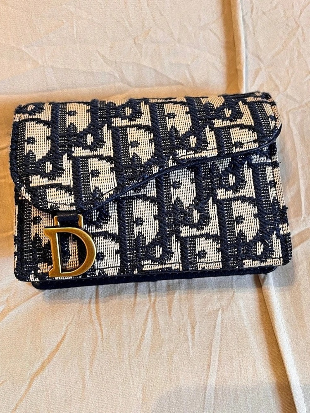 Navy and cream colored monogram wallet